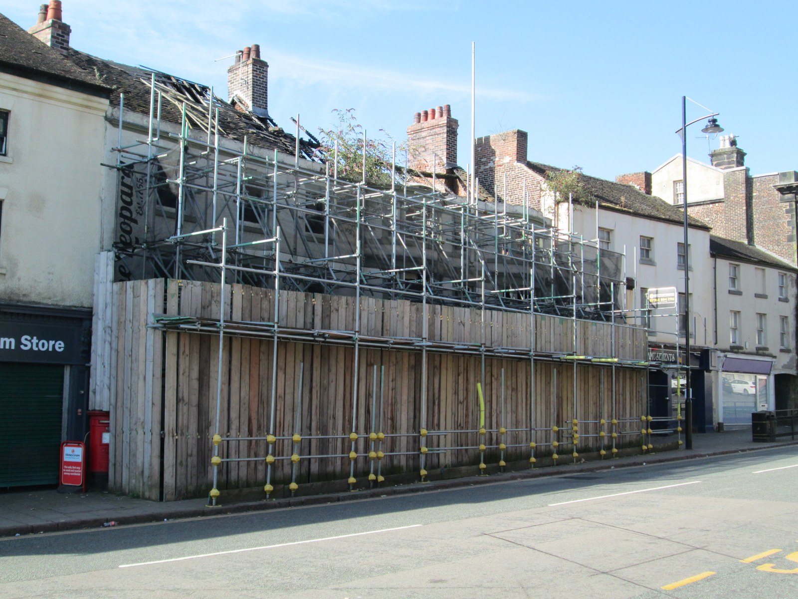The fire-damaged Leopard in Market Place, Burslem, behind scaffolding and hoardings in 2024 (file photo)