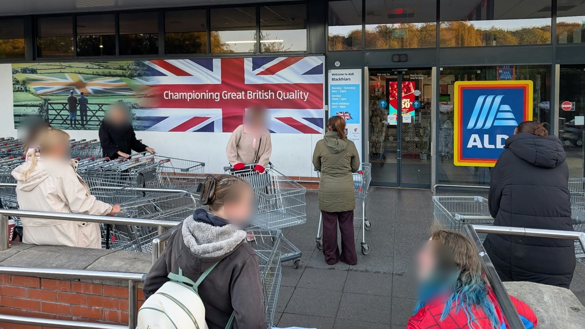 Shoppers Queue Outside Newcastle-under-Lyme Aldi Before Opening For Wooden Toy Event